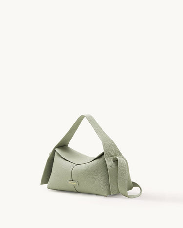Small green pebbled leather crossbody bag with adjustable strap and gold embossed logo.