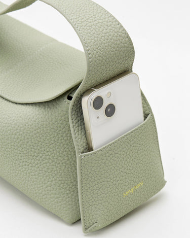 Light sage green full-grain leather handbag with phone pocket and 'Songmont' gold logo