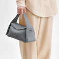 Grey full-grain leather Small Drippy Roof Bag with tan linen outfit