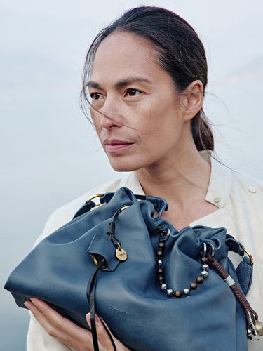Navy Small Gather Bag Set made of full-grain nappa leather with decorative beaded straps and gold hardware.