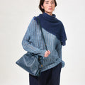 Navy Small Gather Bag Set worn by model with distressed blue sweater and dark jeans.