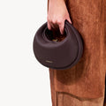 Small Luna Bag in Burgundy, crafted from full-grain leather with a textured finish and gold-tone clasp.