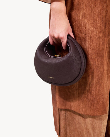 Small Luna Bag in Burgundy, crafted from full-grain leather with a textured finish and gold-tone clasp.