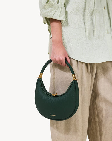 Emerald green pebble-grain Small Luna Bag with gold hardware and clasp. Handheld with rounded strap.