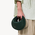 Small Luna Bag in emerald green pebbled leather, a curved handbag by Songmont.