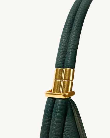 Small Luna Bag in emerald green textured leather with gold clasp detail, featuring Songmont logo.