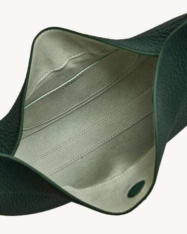 Small Luna Bag in Emerald, interior view with suede lining and textured leather exterior
