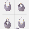 Small Luna Bag in lavender textured leather with gold hardware, a curved handle, and a detachable strap.