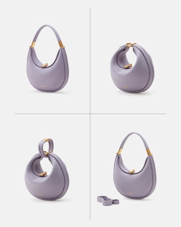 Small Luna Bag in lavender textured leather with gold hardware, a curved handle, and a detachable strap.