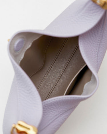 Small Luna Bag in light purple pebble-grain leather with taupe interior and gold hardware.