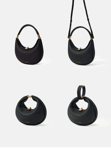 Small Luna Bag in Onyx black full-grain leather, showcasing versatile carrying styles with gold hardware.