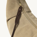 Medium Luna Hobo Bag in Dune Suede with gold zipper and debossed "Songmont" leather pull.
