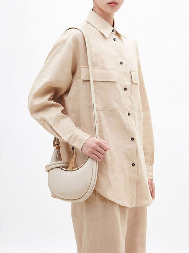 Ivory full-grain leather Small Luna bag with cream apricot cotton and leather leash.