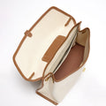 Open canvas Small Shan Satchel Bag with tan leather trim and interior pockets.