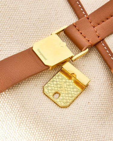 Small Shan Satchel Bag: gold clasp with 'Songmont' logo on leather strap, gold patterned buckle.