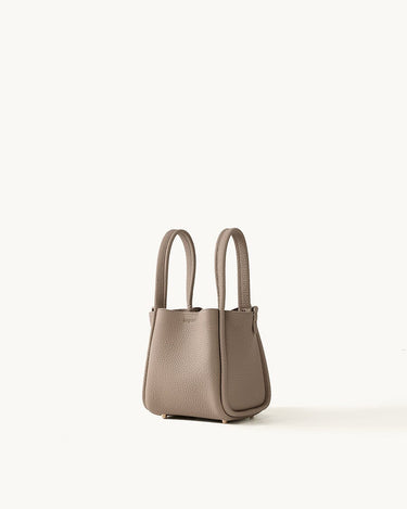 Small taupe full-grain leather Song Bag with magnetic closure and gold feet