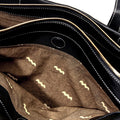 Interior of black Small Yore Duffle Bag with patterned lining and visible compartments.