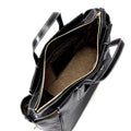 Small Yore Duffle Bag in Onyx, black leather with white stitching, open interior compartments, gold zipper.