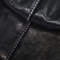 Black Small Yore Duffle Bag: vegetable-tanned leather with white stitching. Elegant travel bag.