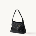 Small Yore Hobo Bag in Onyx: Vegetable-tanned leather with white stitching and gold hardware.