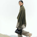 Small Yore Hobo Bag in Onyx crafted from vegetable-tanned leather, featuring adjustable strap and multiple pockets.
