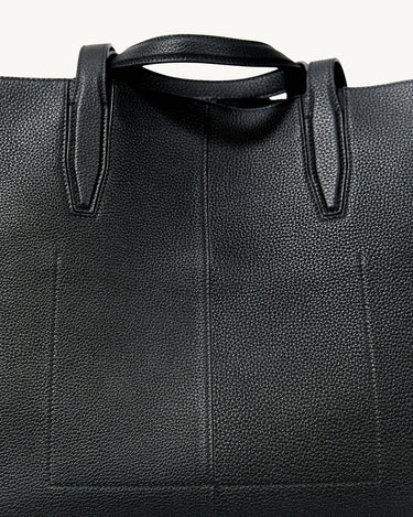 Black textured leather small Yore tote bag with detailed stitching on handles and seams.