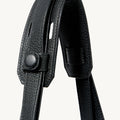 Small Yore Tote Bag in Onyx: Textured black leather strap with snap button detail.