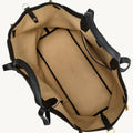 Small Yore Tote Bag in Onyx: Full-grain leather exterior, tan interior with pockets. Open top design.