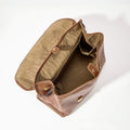 Large Shan Briefcase in Sandal leather, open to show interior compartments and laptop pocket.