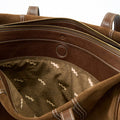 Medium Yore Duffle Bag in Sandal Suede, showcasing interior with patterned lining, zippers, and suede leather details.