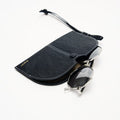 The Yore Glasses Case: Vegetable-tanned leather with white stitching and stainless steel hardware.