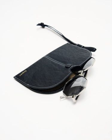 The Yore Glasses Case: Vegetable-tanned leather with white stitching and stainless steel hardware.