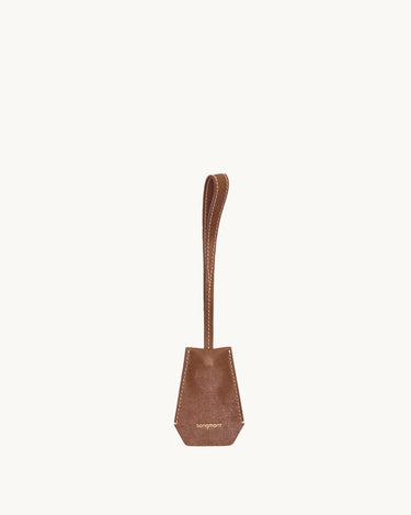 Sandal colored Yore Key Chain crafted from vegetable-tanned leather with white stitching and embossed Songmont logo.