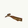Brown vegetable-tanned leather luggage tag with white stitching and gold "Songmont" embossed logo