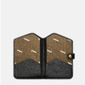 The Yore Passport Case in Onyx, interior view with card slots and tiger tooth lining.