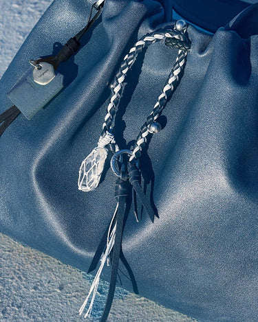 Tranquil Crystal Charm: blue leather bag, braided charm, crystal pendant, Moonstone color, Songmont tag.
