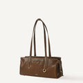 Yore Baguette Bag in Sandal leather with contrasting stitching and gold hardware.