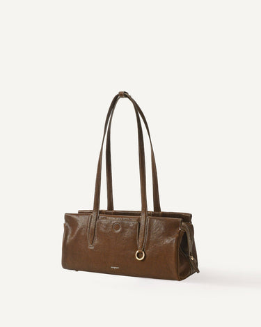 Yore Baguette Bag in Sandal leather with contrasting stitching and gold hardware.