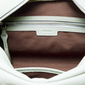 Pale mint green full-grain leather Yore Toast Bag interior with brown fabric lining and SS 304 vacuum electroplated zipper.