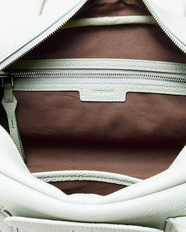 Pale mint green full-grain leather Yore Toast Bag interior with brown fabric lining and SS 304 vacuum electroplated zipper.