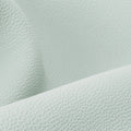 Close-up of light mint full-grain leather texture for Yore Toast Bag