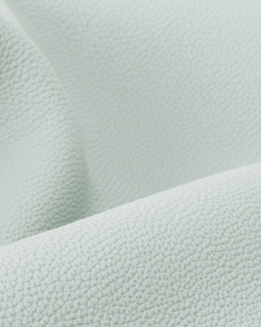 Close-up of light mint full-grain leather texture for Yore Toast Bag