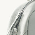 Light blue Yore Toast bag made of full-grain leather with silver hardware zipper detail.