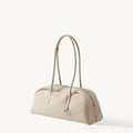 Yore Toast Bag in Cloud: Full-grain tumbled leather, rounded silhouette, baguette-inspired design, Songmont embossed logo.