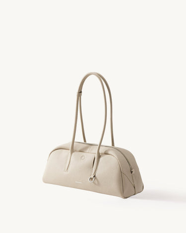 Yore Toast Bag in Cloud: Full-grain tumbled leather, rounded silhouette, baguette-inspired design, Songmont embossed logo.