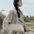 Yore Toast Bag in Cloud color, made of full-grain tumbled leather, with smooth edges and a textured finish.
