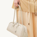 Yore Toast Bag in Cloud color, made of full-grain tumbled leather with rounded edges and flowing lines.