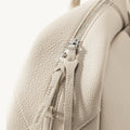 Yore Toast Bag in Cloud: Textured leather, silver zipper, and Songmont logo detail