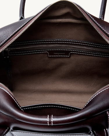 Ebony Yore Toast Bag interior showing fabric lining and zippered pockets, detailed stitching.