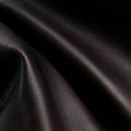 Ebony Nappa leather texture close-up for Yore Toast Bag. Soft, full-grain, rich color.
